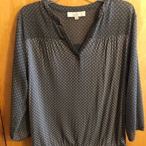 Gray and cream colored blouse